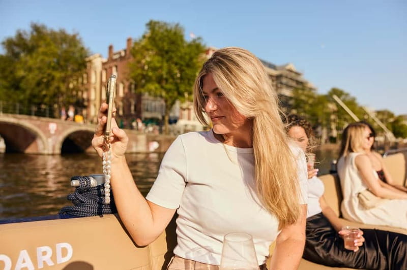 Amsterdam: Spanish Guided Open Boat Cruise with Bar Onboard - The Canal Belt and Herengracht