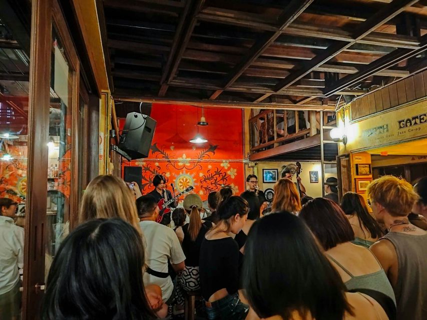 Chiang Mai: Chiang Mai Bar Hopping Guided Night Tour - Ton Lam Yai Market adds flowers, snacks, and river air