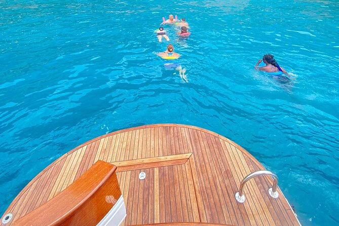 From Positano : Elite Capri Boat Day Free Bar, Brunch & City Walk - Caves, cliffs, and the water around Capri