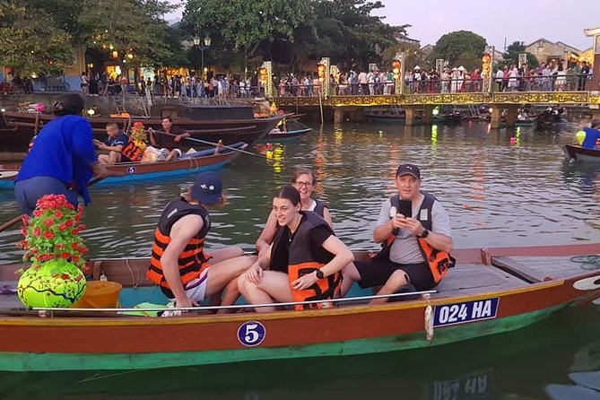 Hoi An Nightlife Tour with Hoi An Ancient Walking Tour, Boat Ride, Night Market - The Japanese Covered Bridge in a crowded old quarter