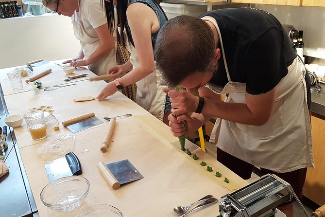 Italian Cocktail + Art of Making Pasta Cooking Class In Unique Milan Location - Sitting down to eat what you made