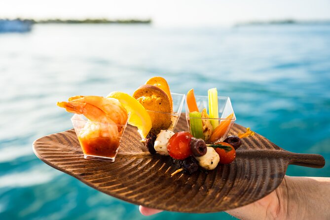 Key West Sunset Sail with Open Bar, Live Music and Hors D'oeuvres - Reading Key West from the water