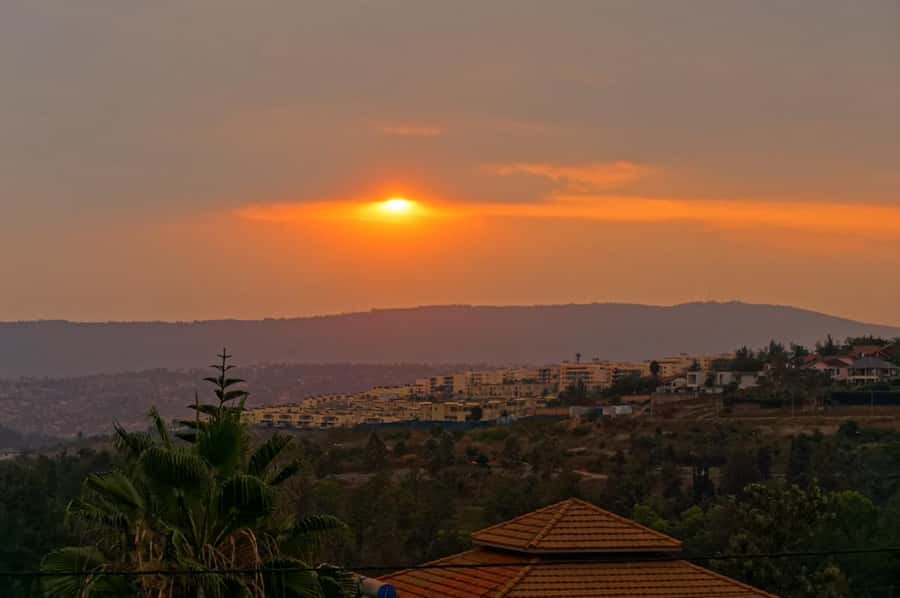 Kigali: Sunset Drinks, Dinner, and Nightlife Tour - Eating brochettes, grilled fish, and ugali