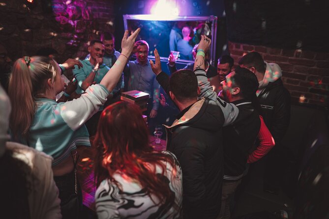Krakow Club Crawl with 1 Hour Free Alcohol & Free VIP Entrance - Moving through Krakow with an international group