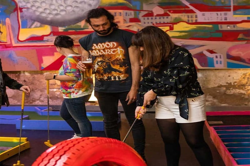Lisbon: 18-Hole Indoor Minigolf Ticket with Bar Area - Pool, air hockey, football tables, darts, and the bar