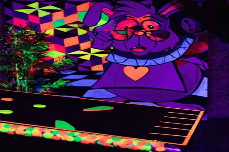 Lisbon: 18-Hole Indoor Minigolf Ticket with Bar Area - The UV neon section and glow-ball play