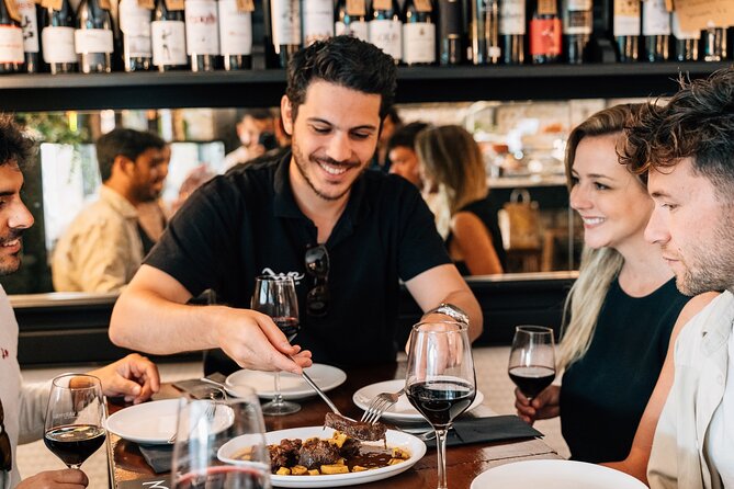 Madrid Local Tapas, Wine Bars & Flamenco Show - Iberian ham and a walk across Plaza Mayor