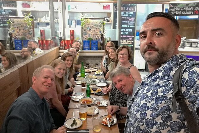 Madrid Tapas & Wine Tasting Walking Tour – Small Group Local Bars - Plaza del Ángel and the wine shop behind the bottles
