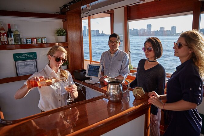 New York City Sunset Cocktail Cruise on Small Yacht - Leaving Chelsea Piers with the Empire State Building behind you