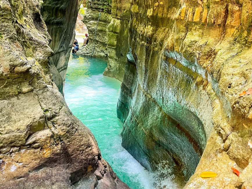 Puerto Plata: Damajagua Waterfalls Canyoning & Cocktail - Limestone walls, mountain water, and natural slides