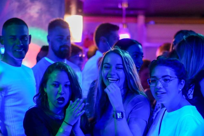 Riviera Bar Crawl Party with Free Shots and VIP Entry - Walking into Nice’s Old Town after dark