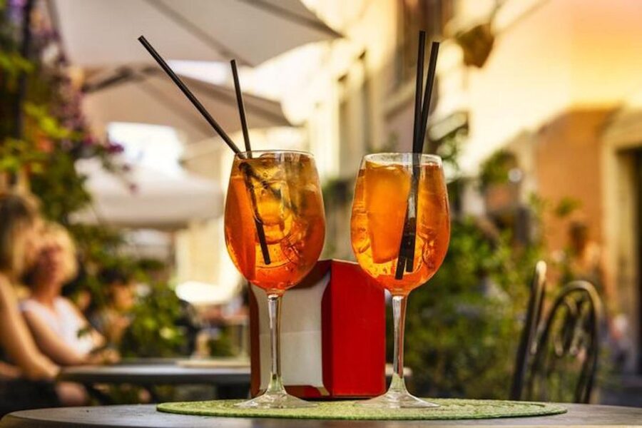 Rome: Evening Walking Tour with Cocktails and Local Guide - Crossing Ponte Sant’Angelo for Vatican views