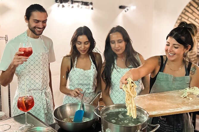 Rome Tipsy Cooking Class: Make Pasta and Mix 3 Spritz Cocktails - Rolling and cutting fresh fettuccine