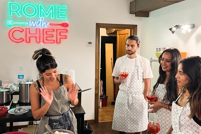 Rome Tipsy Cooking Class: Make Pasta and Mix 3 Spritz Cocktails - Sitting down with the group to eat