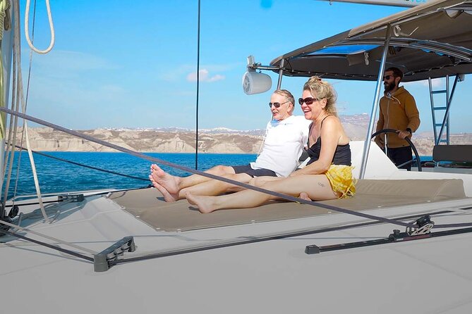 Santorini Catamaran Cruise with Greek Meal, Open-Bar and Sunset - Red Beach gives you a second kind of swim