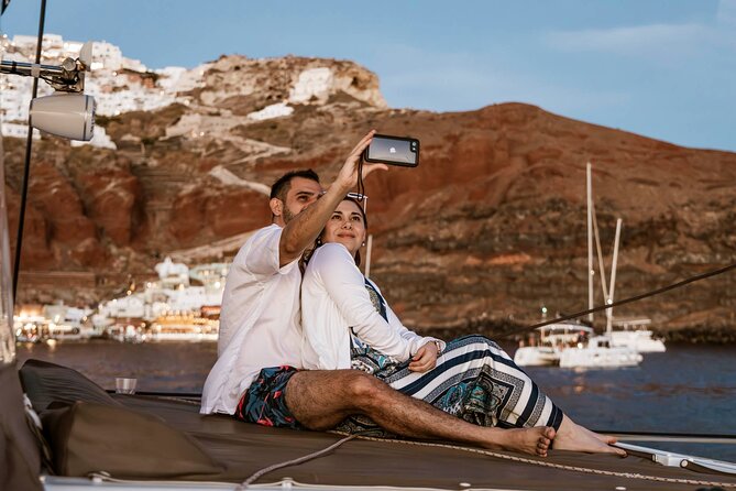 Santorini Catamaran Cruise with Greek Meal, Open-Bar and Sunset - White Beach and the southern coast fill out the picture