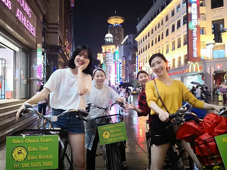 Shanghai: 4-Hour Nightlife Adventure & Tasting Bike Tour - Pudong towers and the Huangpu River at night