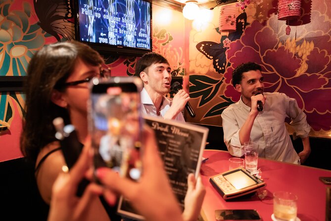 Shinjuku Underground Nightlife Tour: Izakaya Food & Bar Hopping - Kabukicho turns the walk into a neon night