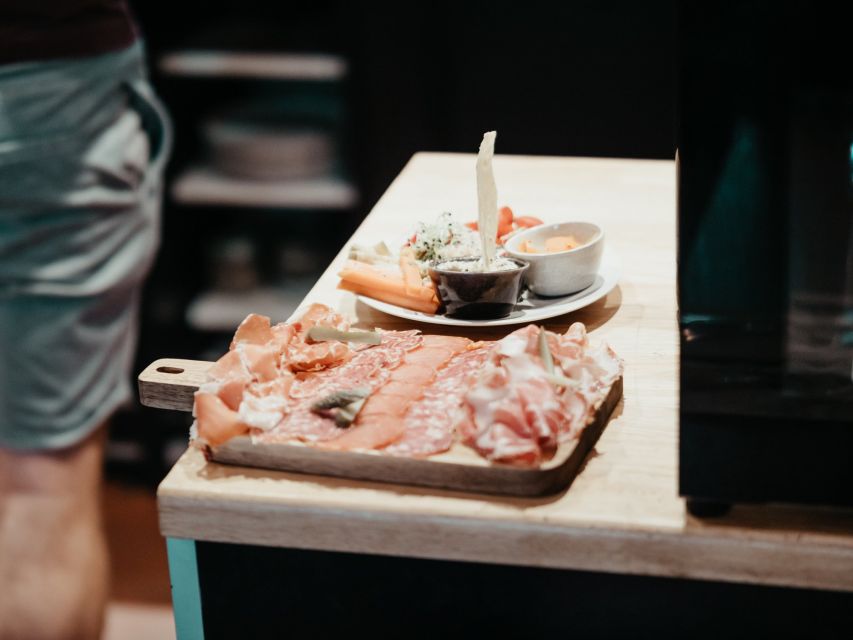 Toulouse: Wine Bar Walking Tour with a Local Wine Expert - Second Stop: Local Wine With Apéro Food