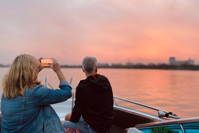 VIP Tour in Saigon: Romantic Sunset Cocktail by SpeedBoat - When the city lights begin to appear