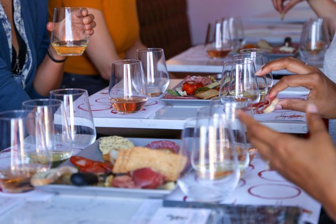 Wine and Cheese Tasting Lunch in Portuguese Wine Bar - Portuguese cheese and charcuterie at the table